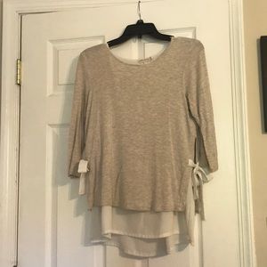 Tan and white layered blouse with ties on side